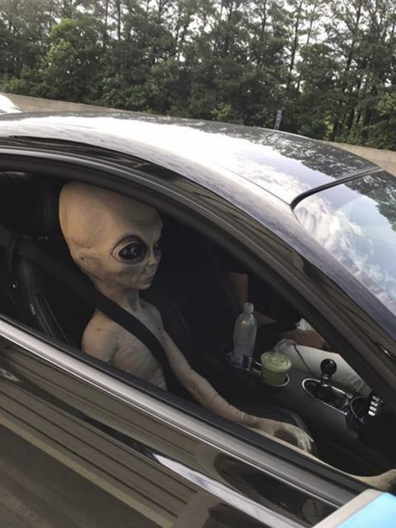 alien doll in the passenger seat.jpg